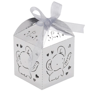 Macro shot of silver laser-cut elephant candy box with a grey ribbon bow for parties