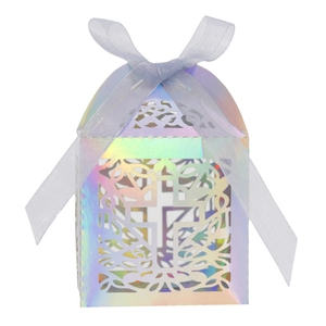 Close-up of laser-cut cross hollow gift box with iridescent finish and blue ribbon