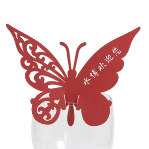 Red butterfly-shaped laser cut paper place card for wine glass with intricate hollow patterns