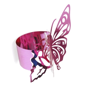 Detail of rose pink butterfly napkin ring with laser-cut metallic hollow design