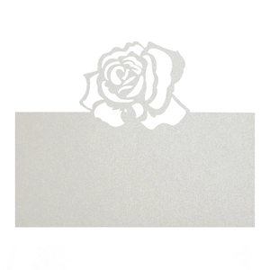 Detailed view of pearlescent white laser-cut rose name card for weddings and events