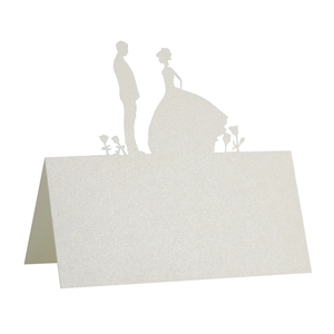 Laser-cut white wedding place card with shimmer texture and bride groom silhouette