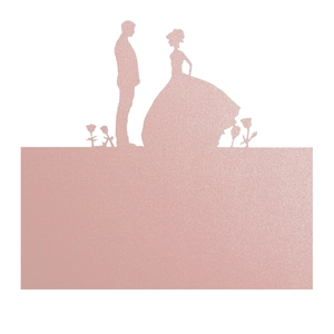 Detail view of rose gold glitter wedding place card featuring laser-cut couple and roses