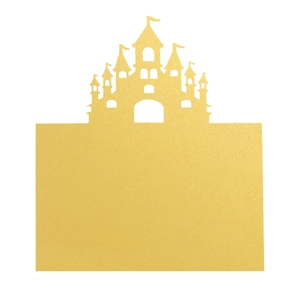 Detail of laser-cut golden card with a castle silhouette and shimmering glitter texture