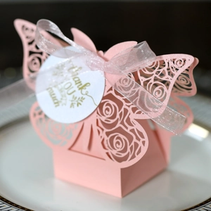 Detail of pink laser-cut butterfly candy box with Thank You tag and ribbon bow