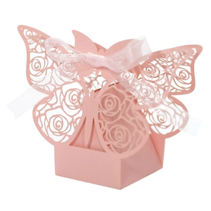 Detailed laser-cut pink wedding favor box with hollow rose patterns and a butterfly top
