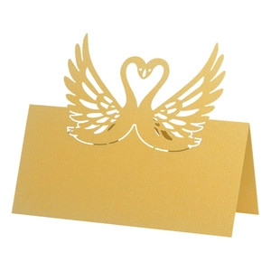 Laser-cut swan place cards in gold pearlescent paper for wedding table decorations