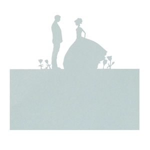 Macro shot of light blue wedding place card featuring laser-cut bride and groom silhouette