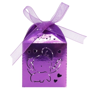 Detail of purple metallic hollow elephant candy box with laser cut hearts and satin ribbon bow