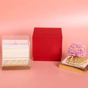 Detail view of 3D paper-cut cherry tree memo pad with red gift box and acrylic cover