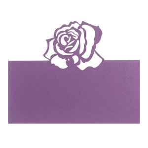 Detail of lavender laser-cut place card with elegant rose hollow pattern and blank name area