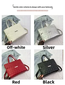 Quilted tote bags in off-white, silver, red, and black with elegant metal logo detail