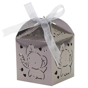 Detail of silver hollow elephant candy box with a white ribbon bow for parties