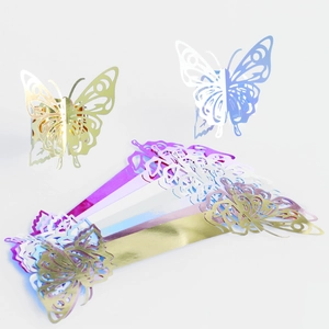 Macro detail of laser-cut butterfly napkin rings in vibrant iridescent metallic colors