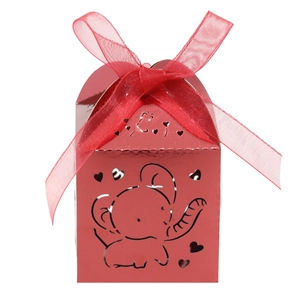 Detail of red hollow-out elephant candy box with heart patterns and silk ribbon bow