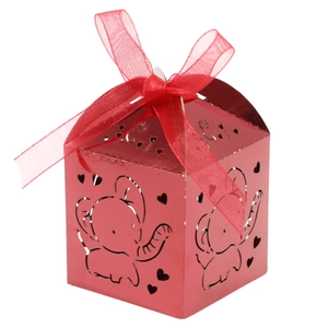 Pink laser-cut elephant gift box with hollow heart patterns and a red ribbon bow