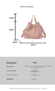 Pink nylon drawstring bucket bag dimensions showing adjustable strap and size details