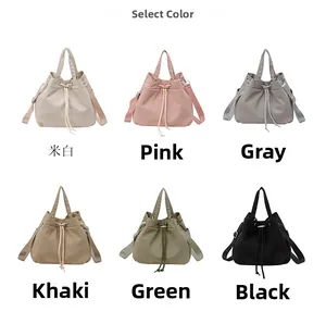 Selection of drawstring nylon bucket bags in six colors including khaki pink and black