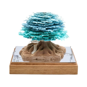 Creative 3D paper sculpture memo pad featuring a lush blue-green treehouse model on wood base