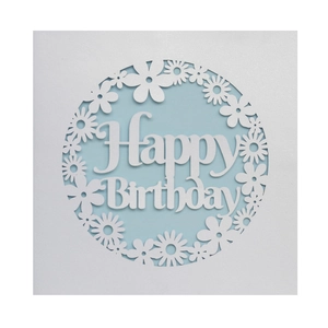 Macro detail of laser-cut Happy Birthday card with white daisy and light blue inlay