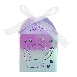 Detail of pink laser-cut elephant candy box with holographic finish and white ribbon