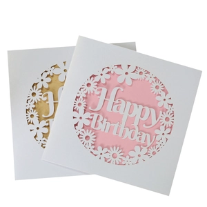 Laser-cut Happy Birthday greeting cards with daisy flower patterns in pink and gold