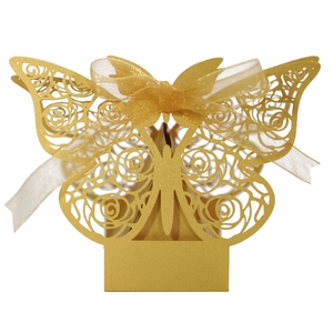 Detail of laser-cut gold butterfly gift box with delicate glitter finish and organza bow