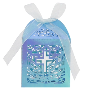 Macro view of iridescent blue-purple laser-cut cross gift box with white organza ribbon