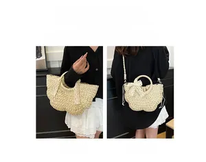 Detail of hand-woven straw bag with lace bow, showing dual hand-carry and crossbody styles