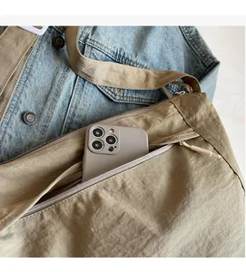 Detail of the internal zipper pocket showing large capacity for a smartphone