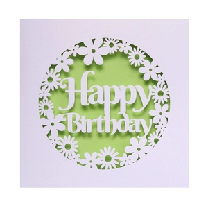 Detailed laser-cut Happy Birthday card featuring white daisies and green background