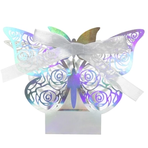 Holographic butterfly favor box with laser-cut floral details and a white organza ribbon bow