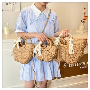 Straw woven bags in three sizes with lace bows and drawstring lining for beach vacation