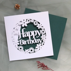 Detailed laser-cut Happy Birthday card with intricate floral patterns and green envelope
