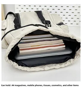 Detailed interior of cream travel backpack showing large capacity for laptop and A4 books