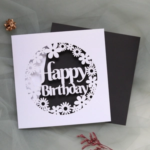 Laser-cut daisy happy birthday card with elegant white hollow design and black envelope