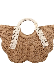 Handwoven straw handbag in butterfly shape with lace handles for summer beach vacations