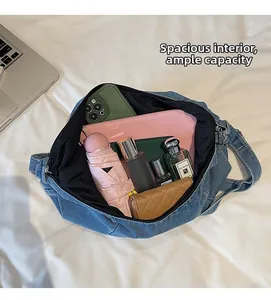 Macro view of blue denim hobo bag interior showing spacious capacity for daily essentials