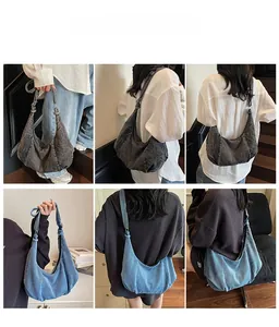 Showcase of large capacity denim hobo bags in dark grey and light blue on models