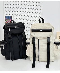 Macro view of nylon travel backpacks featuring multi-pocket design and strap details
