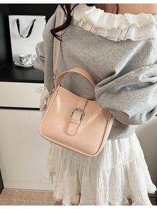 Minimalist pink PU leather bucket bag with silver buckle and elegant pearl charm detail
