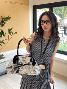 Chic silver sequin tote bag with black leather handles for women's casual fashion