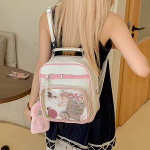 Sac Ita blanc et rose avec fenêtre transparente montrant des badges d'anime