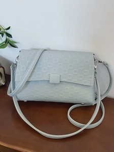 Vintage light blue underarm shoulder bag with geometric checkered flap and silver hardware