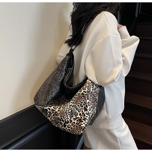 Detail of leopard print patchwork tote bag showing soft fabric texture and large capacity