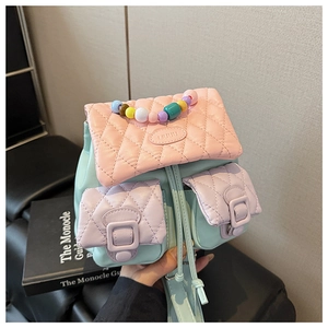 Close-up of quilted macaron patchwork bag with colorful beads and LIUUU branding