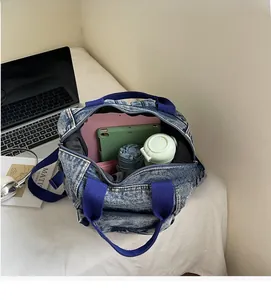 Macro shot of spacious blue denim backpack interior showing storage capacity for daily items