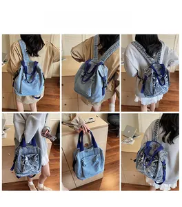 Detail view of denim backpack showing purple straps and dual carry handle options
