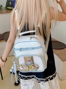 Sac à dos Ita-bag bleu et blanc avec grande fenêtre transparente et boucles en métal argenté
