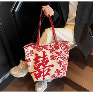 Detail of New Chinese-style wedding tote bag with Xi character and red floral embroidery